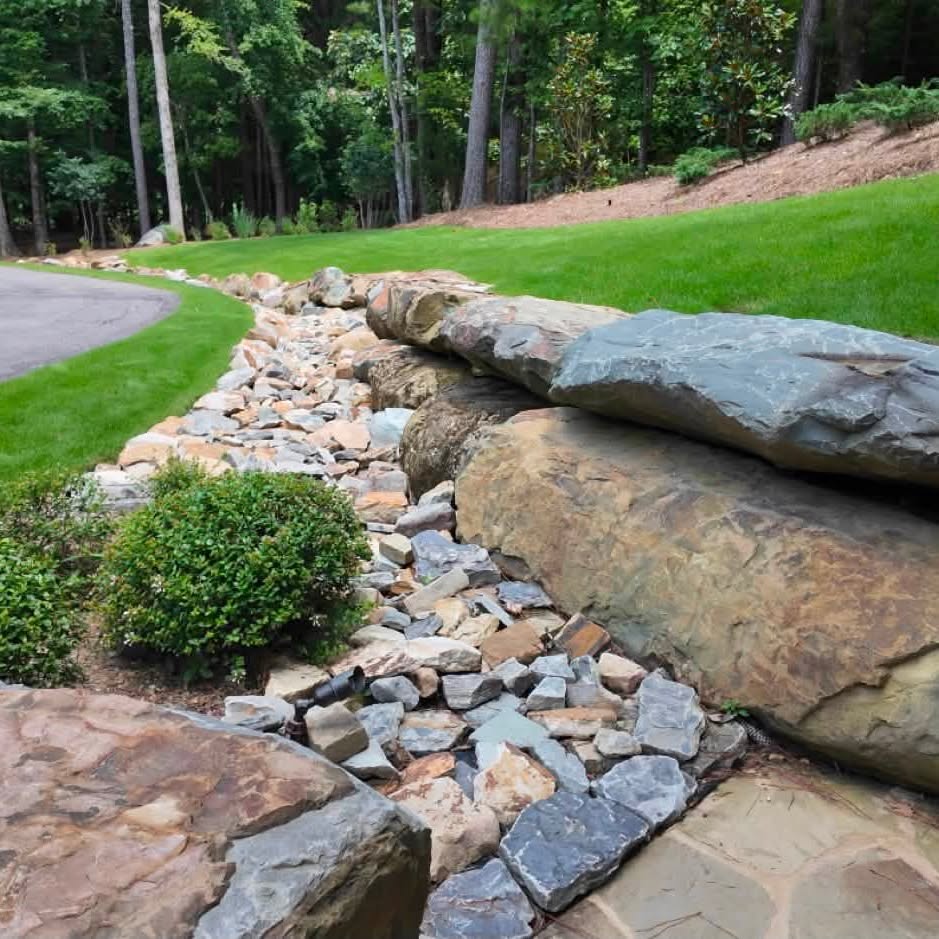 Engineered rock swale and planted slope completed by DSLD