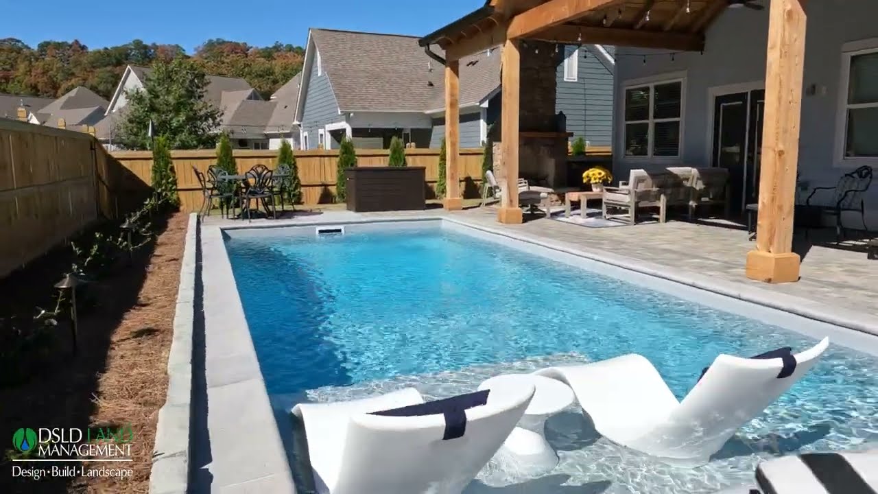 Completed custom pool, patio and outdoor fireplace by DSLD